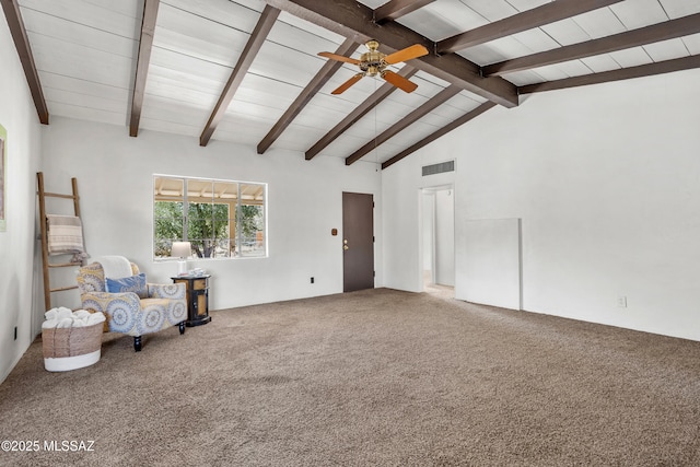 unfurnished room with lofted ceiling with beams, carpet floors, visible vents, and a ceiling fan