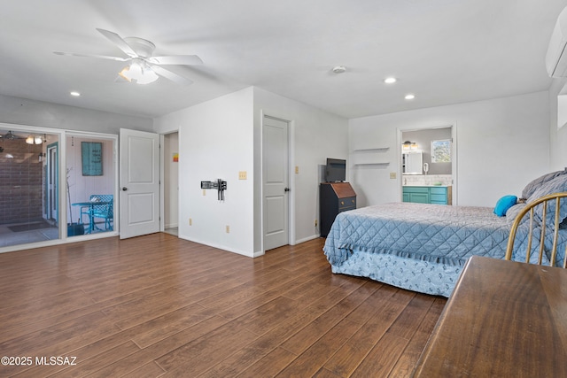 bedroom featuring baseboards, dark wood finished floors, ceiling fan, ensuite bathroom, and recessed lighting