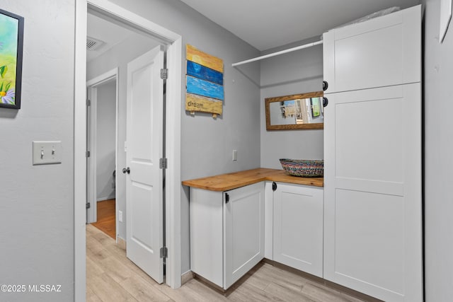 interior space featuring visible vents and light wood finished floors