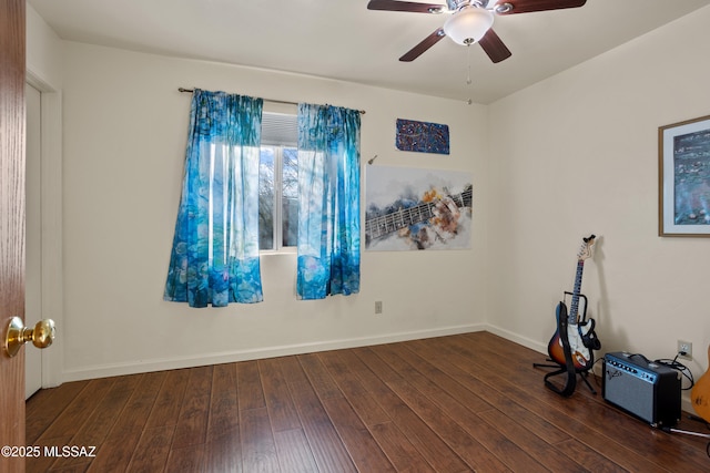 unfurnished room featuring ceiling fan, wood-type flooring, and baseboards