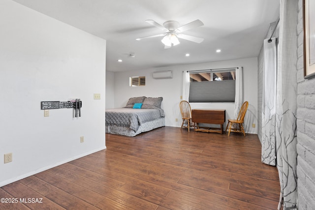 bedroom with baseboards, a wall unit AC, wood-type flooring, ceiling fan, and recessed lighting