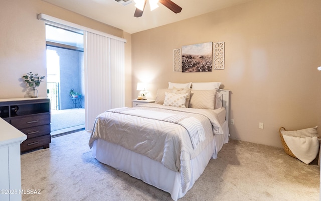 bedroom featuring light carpet, access to outside, ceiling fan, and visible vents