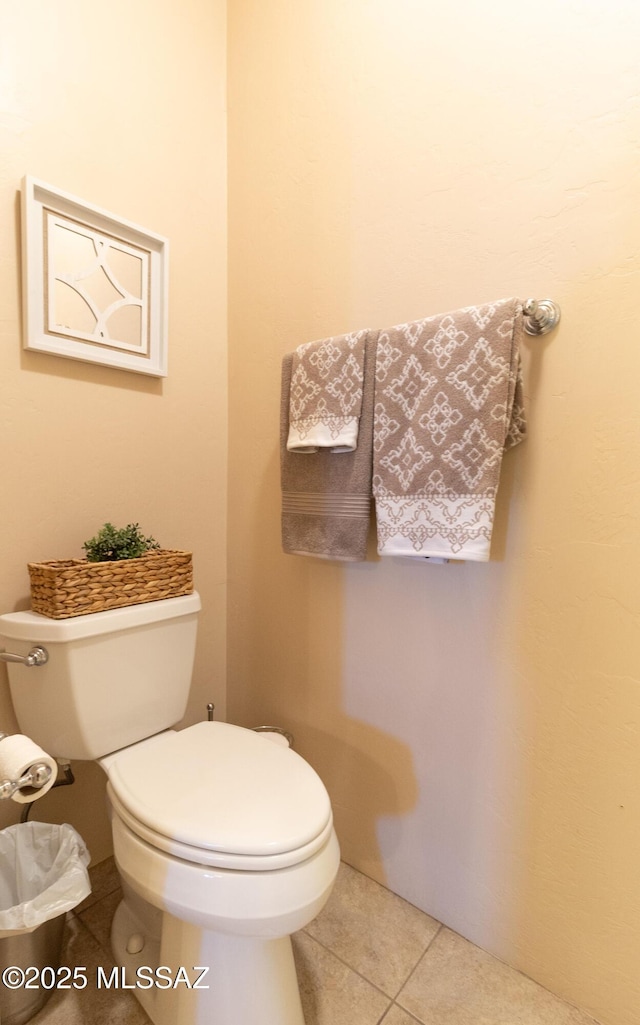 bathroom with tile patterned flooring and toilet