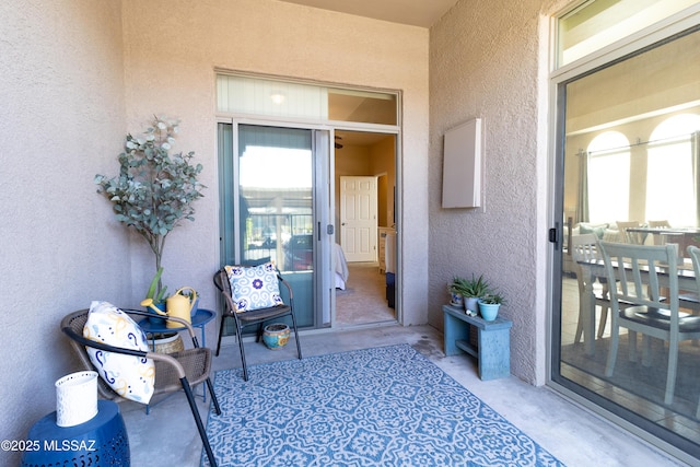 view of exterior entry with stucco siding