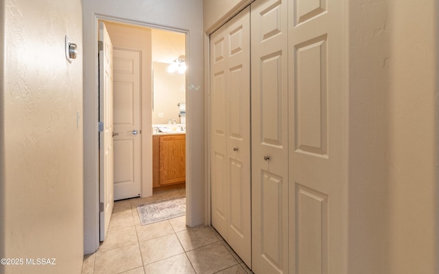 hall with light tile patterned flooring