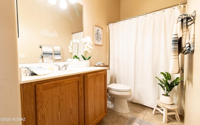 bathroom with toilet, tile patterned flooring, a shower with shower curtain, and vanity