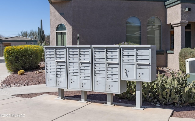 view of home's community with mail area