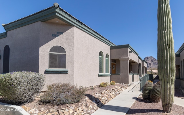 view of side of property with stucco siding