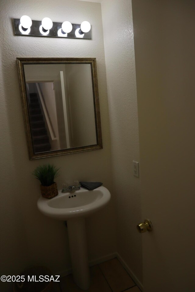 bathroom with tile patterned floors