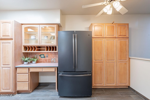 kitchen featuring ceiling fan, light countertops, freestanding refrigerator, wood tiled floor, and light brown cabinetry