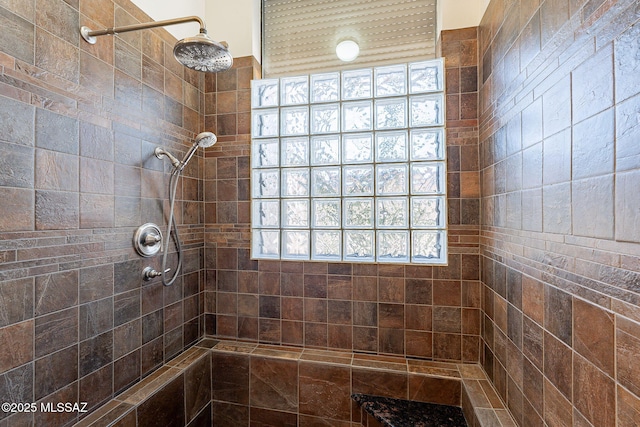 full bath with a tile shower