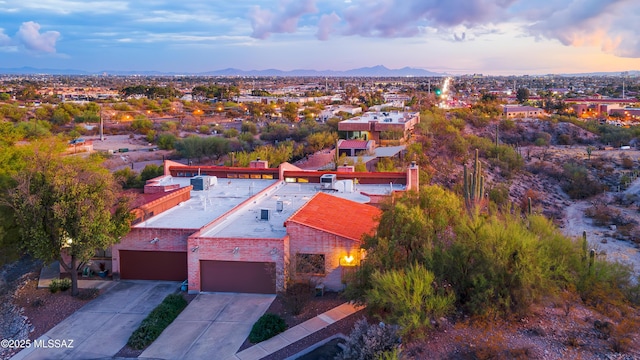 birds eye view of property featuring a mountain view