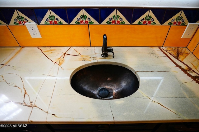 interior details featuring a sink