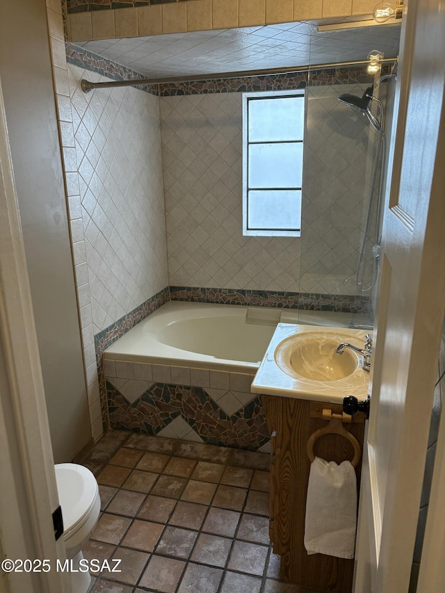 full bathroom with a relaxing tiled tub, toilet, a tile shower, vanity, and tile patterned floors