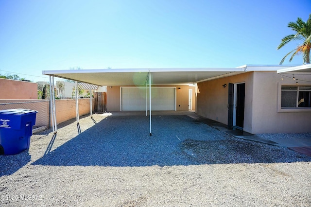 view of parking featuring fence