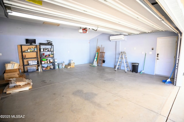 garage featuring a garage door opener and a wall mounted AC