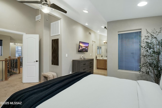 bedroom featuring recessed lighting, connected bathroom, visible vents, and light colored carpet