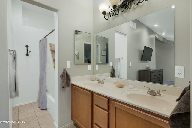 full bath featuring tile patterned flooring, visible vents, a sink, and double vanity