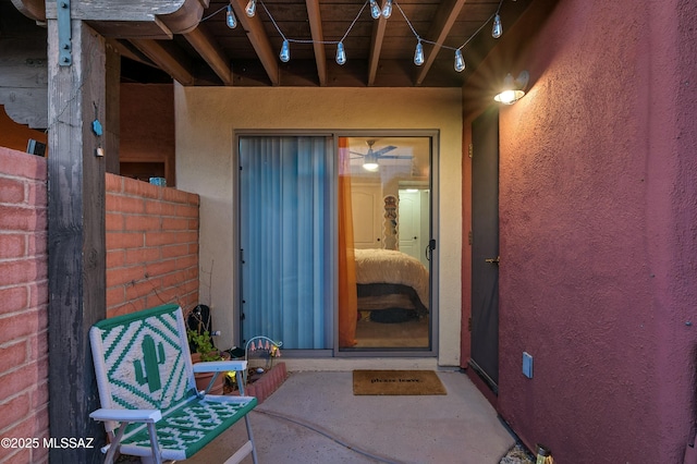 property entrance featuring stucco siding