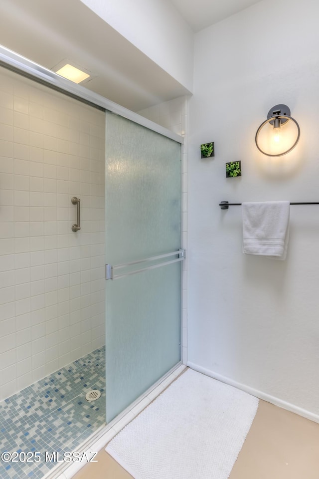 bathroom with a shower stall