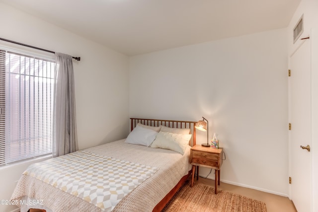 bedroom featuring visible vents