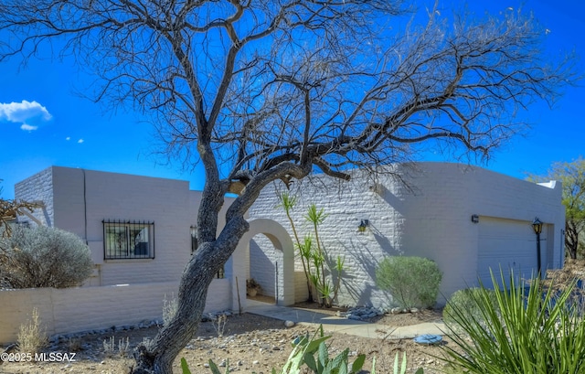 view of side of home with a garage