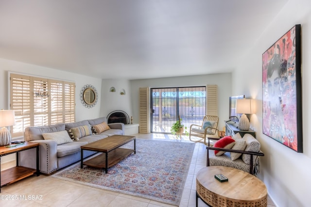 living room with a healthy amount of sunlight and tile patterned floors