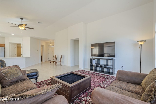 tiled living area featuring a ceiling fan and visible vents