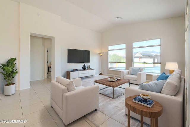 4751 S Longmore Dr, Green Valley, AZ 85622 - living room featuring visible vents, vaulted ceiling, and light tile patterned flooring