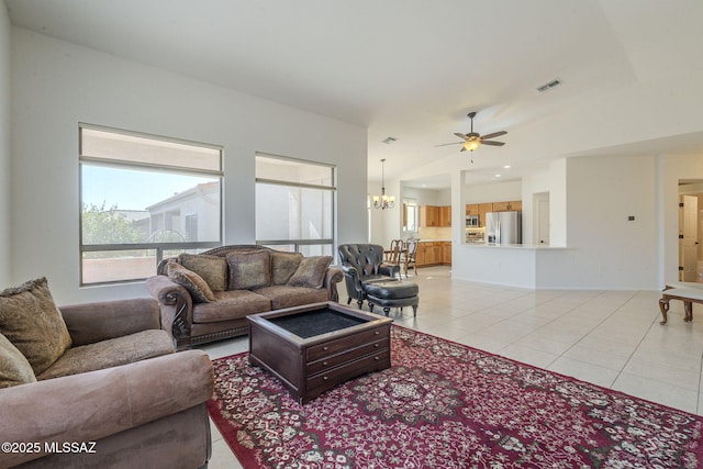 living area with light tile patterned floors, ceiling fan with notable chandelier, visible vents, and recessed lighting