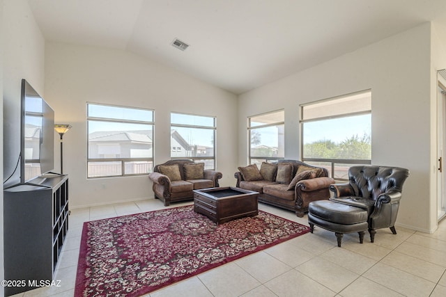 4751 S Longmore Dr, Green Valley, AZ 85622 - living area featuring visible vents, baseboards, vaulted ceiling, and light tile patterned flooring