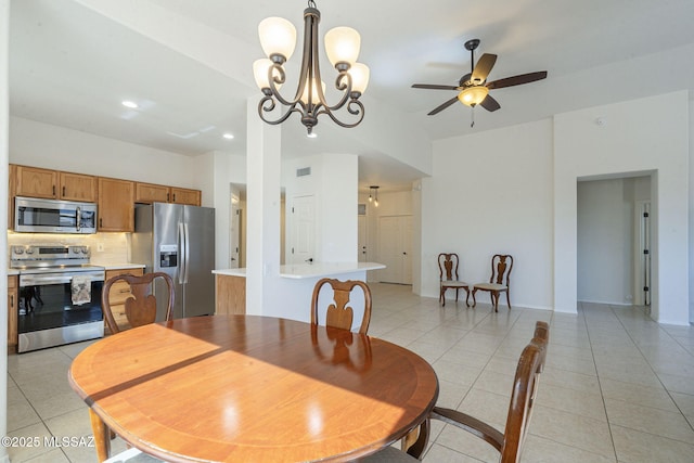 dining space featuring ceiling fan with notable chandelier, recessed lighting, and light tile patterned floors