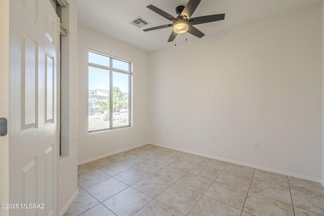 unfurnished room with light tile patterned floors, visible vents, and baseboards