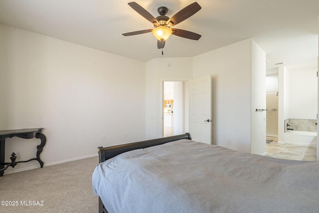 4751 S Longmore Dr, Green Valley, AZ 85622 - bedroom featuring light carpet, ensuite bath, baseboards, and a ceiling fan