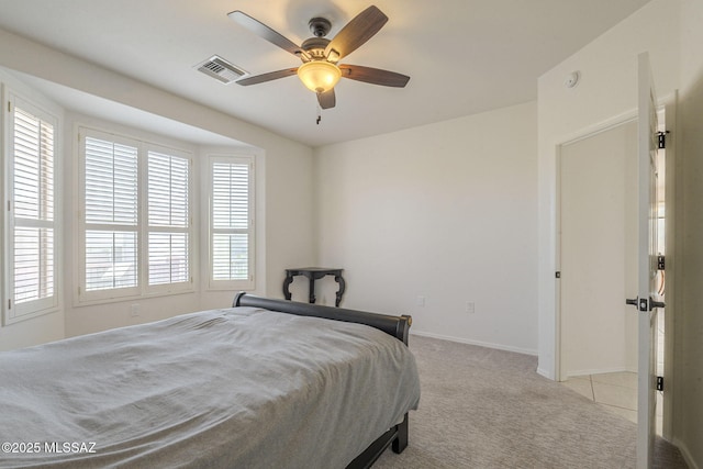 4751 S Longmore Dr, Green Valley, AZ 85622 - bedroom featuring visible vents, baseboards, a ceiling fan, and light carpet