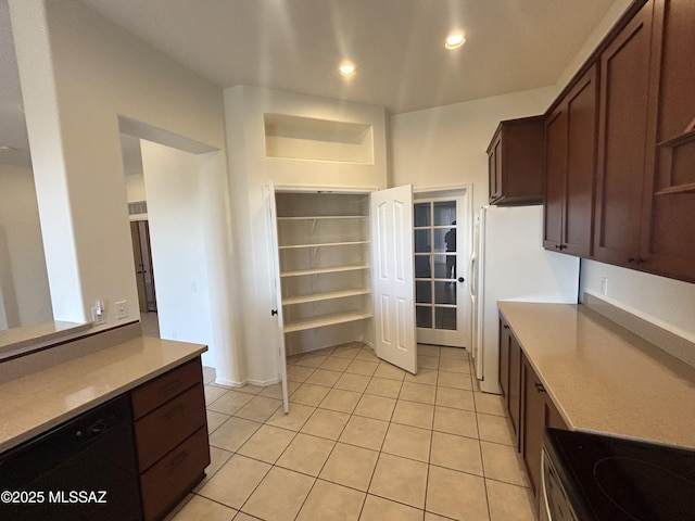 kitchen featuring light tile patterned floors, dishwasher, stainless steel electric range, light countertops, and recessed lighting