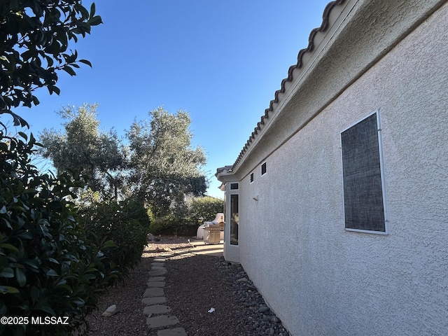 view of side of property featuring stucco siding