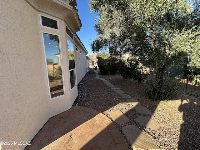 view of yard featuring fence and a patio