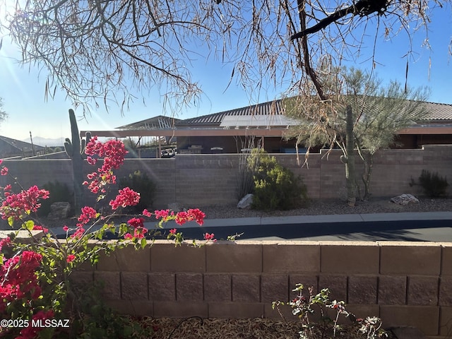 exterior space with a fenced backyard