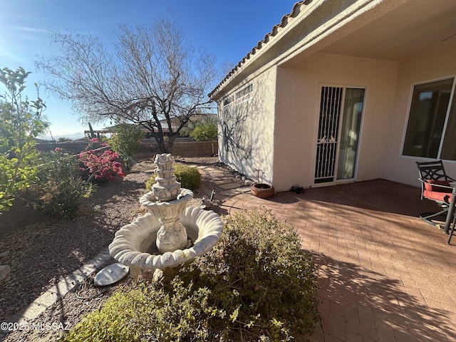 view of yard featuring a patio area and fence