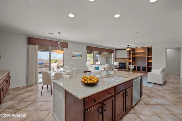 kitchen featuring recessed lighting, visible vents, open floor plan, a sink, and dishwasher