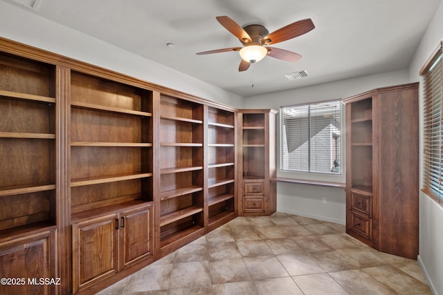 spacious closet with visible vents and a ceiling fan