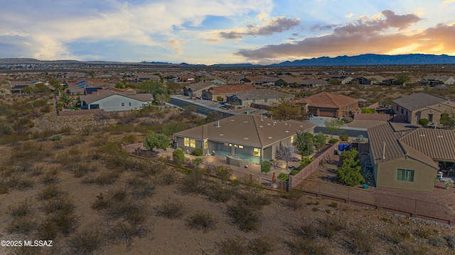 drone / aerial view featuring a residential view and a mountain view