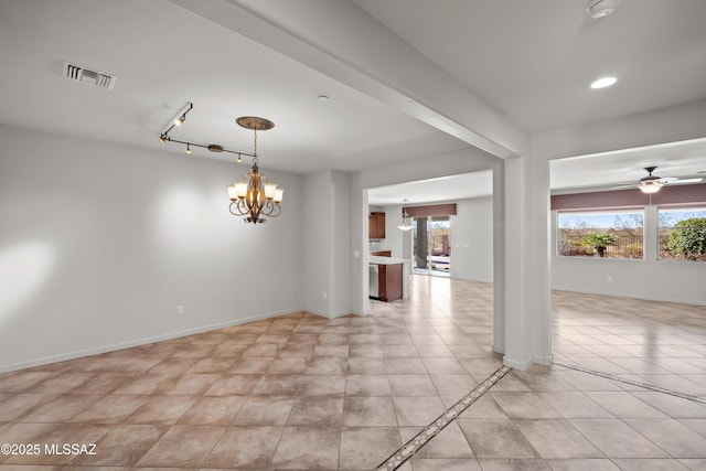 spare room with baseboards, ceiling fan with notable chandelier, visible vents, and light tile patterned flooring