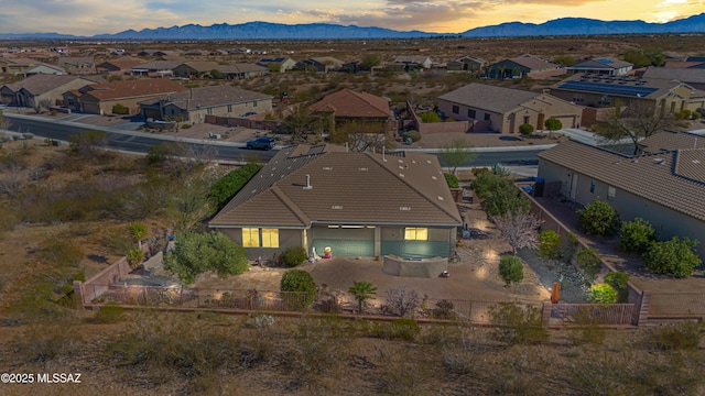 aerial view at dusk with a residential view and a mountain view