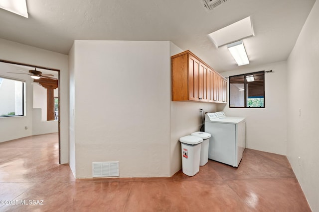 laundry area featuring washer / dryer, a ceiling fan, visible vents, and cabinet space