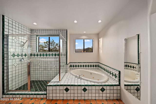 full bath with a stall shower, a tub with jets, and recessed lighting