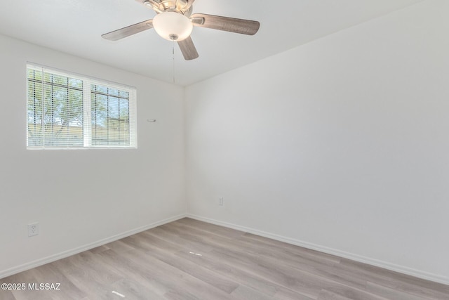 unfurnished room with light wood finished floors, ceiling fan, and baseboards