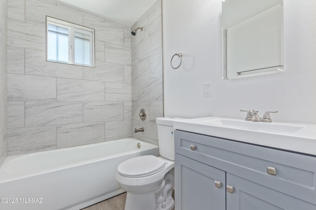 full bathroom with toilet, shower / washtub combination, wood finished floors, and vanity