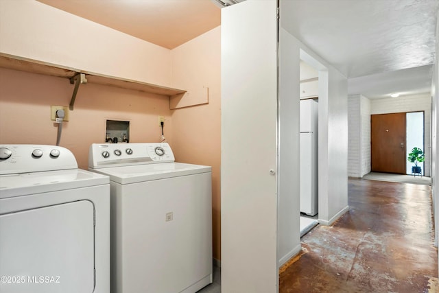 laundry area with washing machine and dryer and laundry area